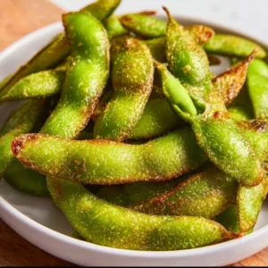 Delicious air fryer edamame served in a bowl, showcasing its crispy texture.