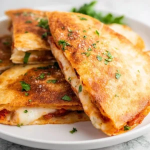 Air Fryer Pizza Quesadilla - crispy and cheesy slices ready to be enjoyed.