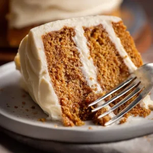 Delicious homemade spice cake decorated with cream frosting and spices.