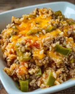 Cheesy taco beef and rice dish served with toppings
