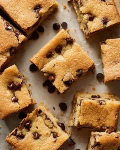 Delicious homemade Chocolate Chip Cookie Bars on a baking tray