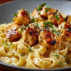 Delicious Garlic Butter Chicken Bites with Creamy Parmesan Pasta served on a plate