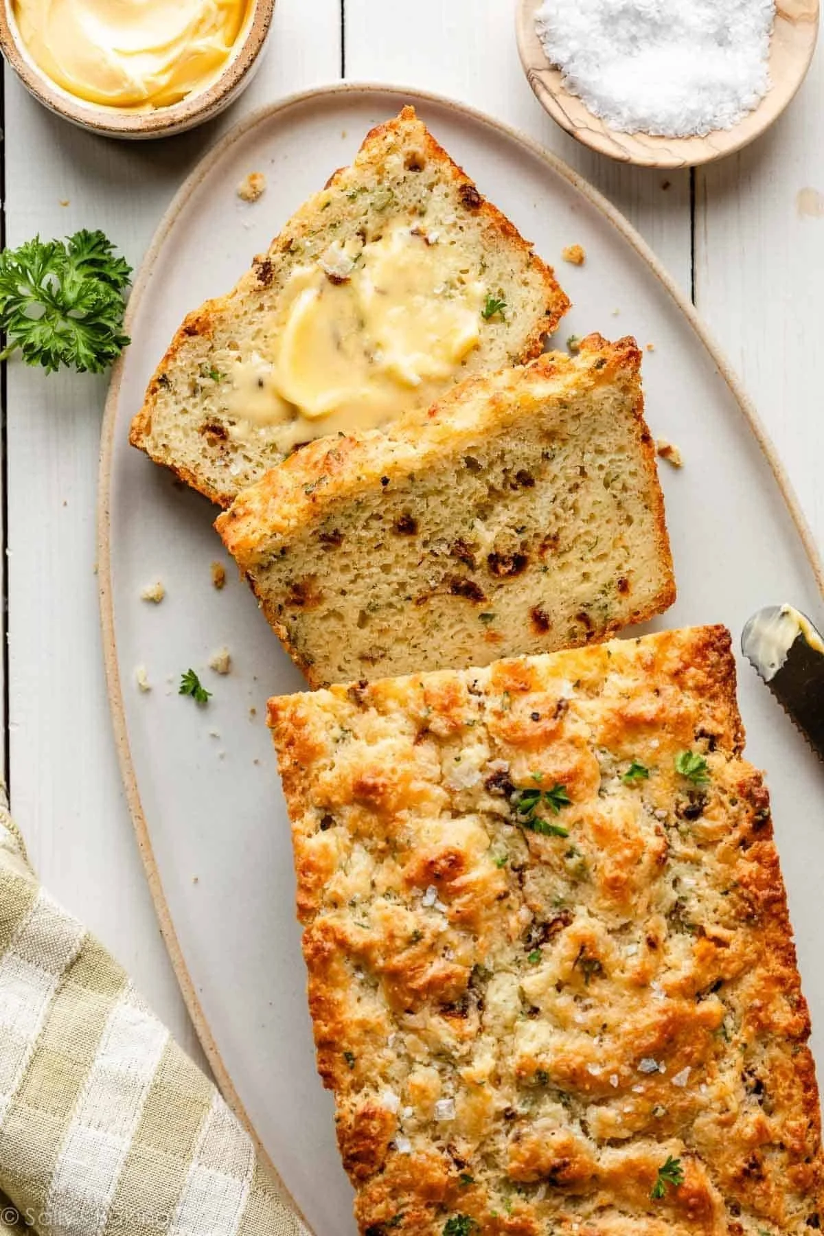 Savory cheese quick bread fresh out of the oven, golden brown and cheesy.